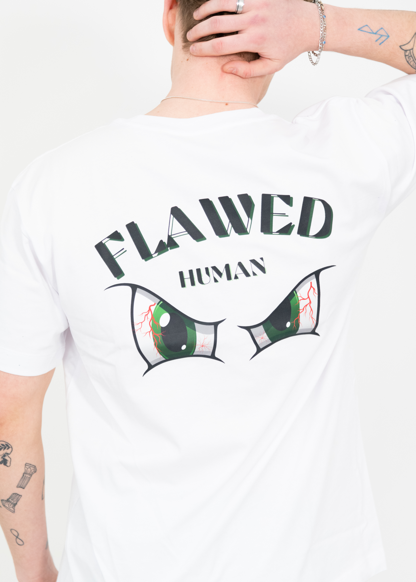 "Stylish white T-shirt featuring an eye-catching eye design on the back, made in the UK from 100% organic cotton, 240 GSM for superior comfort and quality."